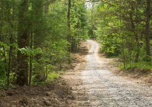 Aerial view of 12.54-acre Trails End Lot 20 in Rock Castle County, Kentucky, showcasing wooded land and surrounding landscape.