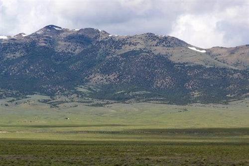 Aerial view of Nevada Mountain Meadow Ranches, Elko County, 40-acre property in T39N R70E Section 17 NW4 NE4, with rugged mountain terrain.