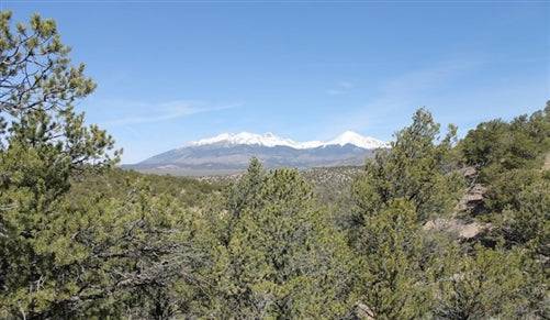Aerial view of Colorado Sangre De Cristo Ranches Lot 1058 in Costilla County, showing open land and surrounding mountains.