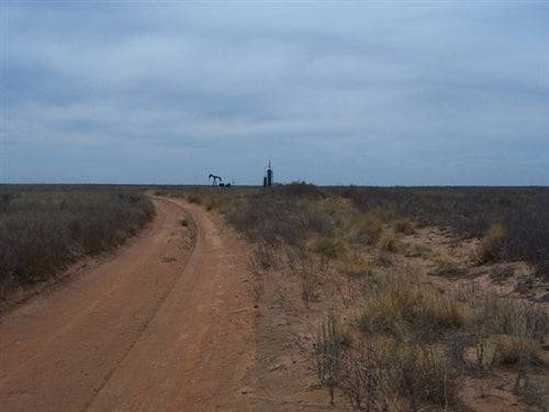 Aerial view of Texas Cochran County 1-acre Western Vistas land for sale, showing open plains and distant horizon.