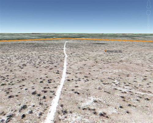 Aerial view of Texas Pecos County 43-acre land parcel for sale by Onlinelandsales, showing open desert landscape and rugged terrain.