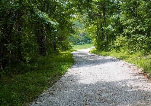 Aerial view of Bluewater Ridge Lot 7 in Wayne County, Kentucky, showing 7.74 acres of wooded land with surrounding natural landscape.
