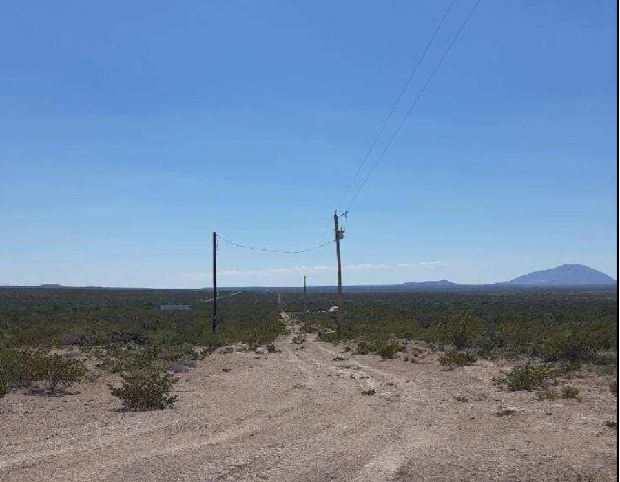 Aerial view of Texas Hudspeth County land parcel, showing open desert landscape with sparse vegetation on the 0.14-acre lot.