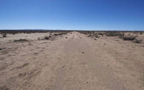 Aerial view of Luna County New Mexico Deming Ranchettes, Lots 7 and 8, showing open land with sparse vegetation.