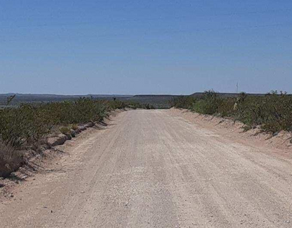 Aerial view of Texas Hudspeth County land lot 10 in Eastern Hills, showing undeveloped 0.14-acre property with natural terrain.