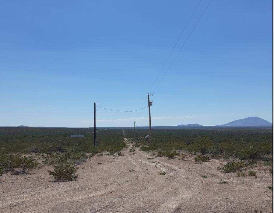 Aerial view of Texas Hudspeth County eastern hills land lot 10, 0.14 acres, showing natural terrain and surrounding landscape.
